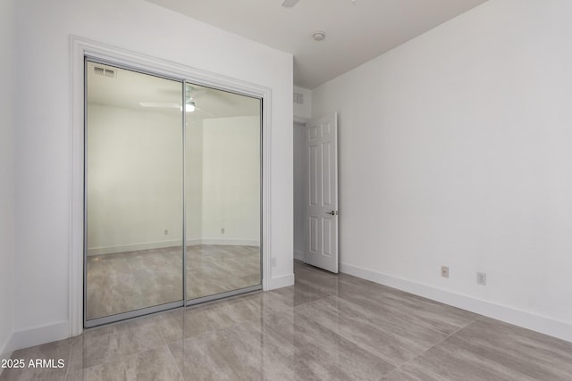 4711 E Buckboard Ct, Gilbert, AZ 85297 - unfurnished bedroom featuring a closet, baseboards, and ceiling fan