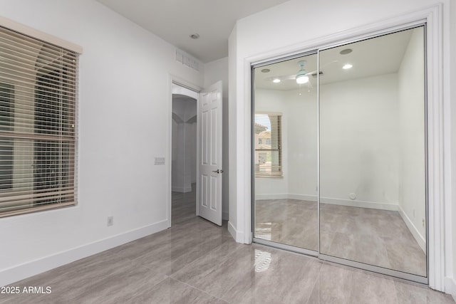 4711 E Buckboard Ct, Gilbert, AZ 85297 - unfurnished bedroom with a closet, baseboards, recessed lighting, and arched walkways
