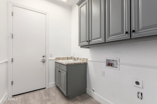4711 E Buckboard Ct, Gilbert, AZ 85297 - laundry area with hookup for an electric dryer, hookup for a washing machine, cabinet space, and baseboards