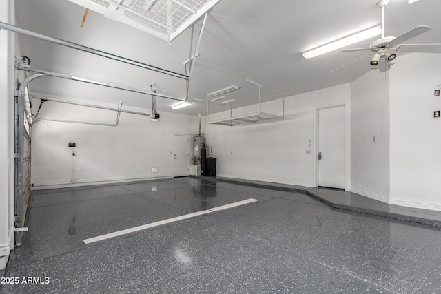 4711 E Buckboard Ct, Gilbert, AZ 85297 - garage with ceiling fan, baseboards, and gas water heater