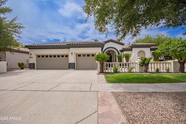 4711 E Buckboard Ct, Gilbert, AZ 85297 - mediterranean / spanish-style house with an attached garage, driveway, stucco siding, and a tile roof