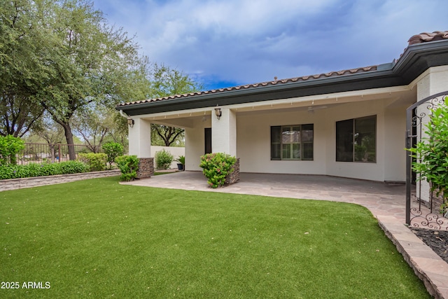 4711 E Buckboard Ct, Gilbert, AZ 85297 - back of property with a patio area, a tiled roof, and stucco siding