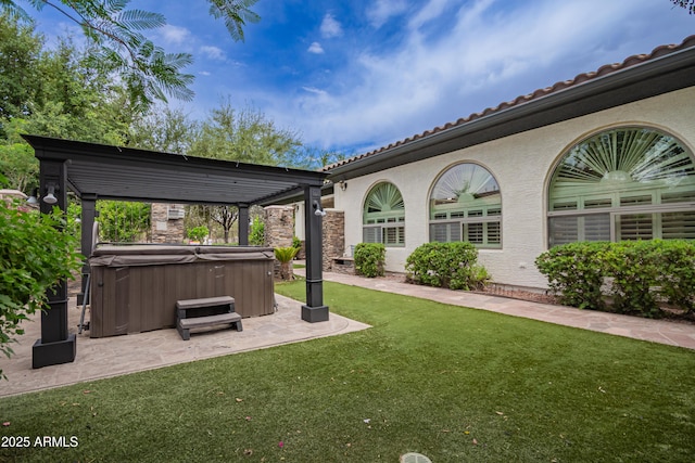 4711 E Buckboard Ct, Gilbert, AZ 85297 - view of grassy yard with a hot tub and a patio area