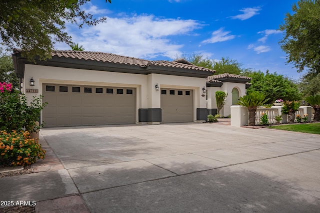 4711 E Buckboard Ct, Gilbert, AZ 85297 - mediterranean / spanish-style house with driveway, a garage, stucco siding, and a tile roof