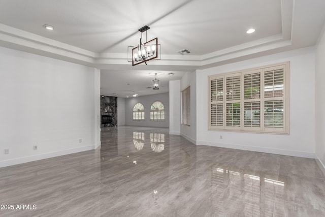4711 E Buckboard Ct, Gilbert, AZ 85297 - unfurnished living room featuring a raised ceiling, a chandelier, baseboards, and recessed lighting