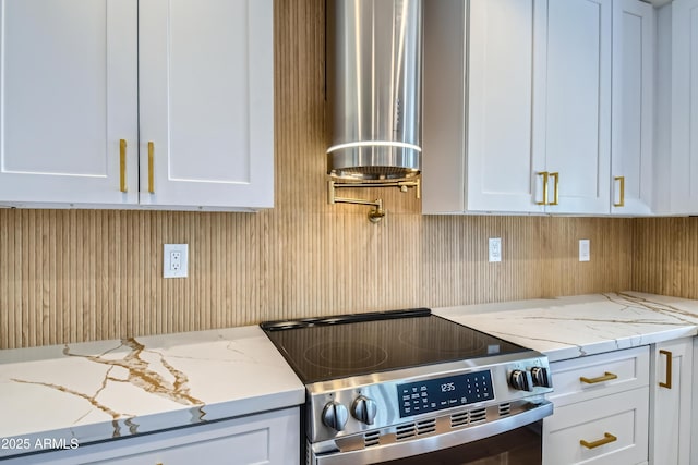 kitchen with white cabinets, stainless steel electric range, water heater, and light stone countertops