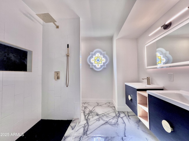 bathroom featuring vanity and a tile shower