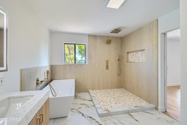 bathroom with vanity, independent shower and bath, and wood walls