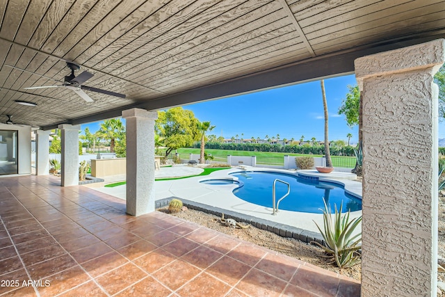 view of pool with ceiling fan and a patio area