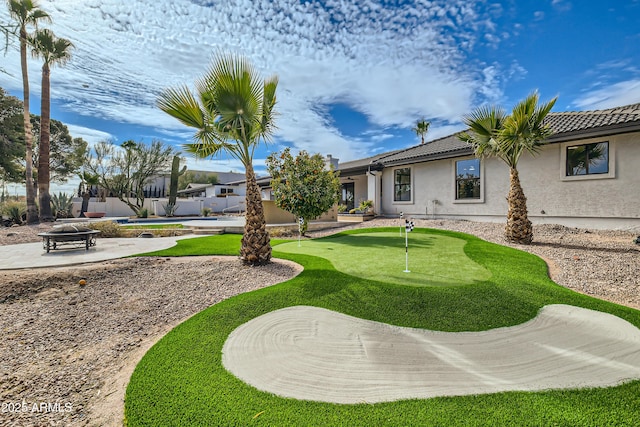 view of yard featuring a patio and a fire pit