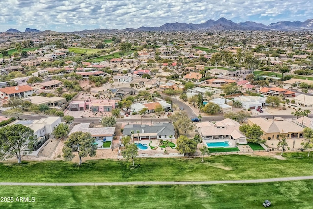 birds eye view of property featuring a mountain view