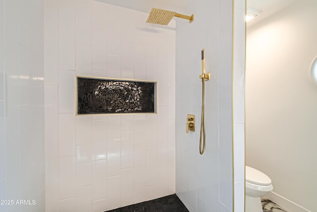 bathroom with toilet and tiled shower