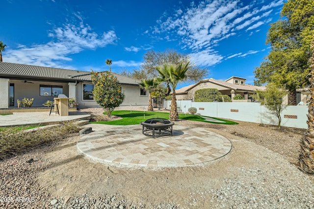 view of patio with a fire pit