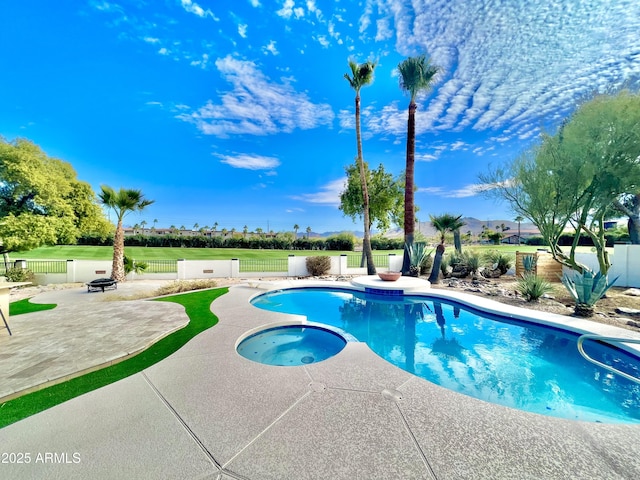 view of pool with an in ground hot tub and a patio