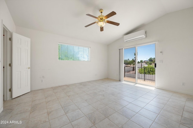 spare room with vaulted ceiling, an AC wall unit, light tile patterned flooring, and ceiling fan