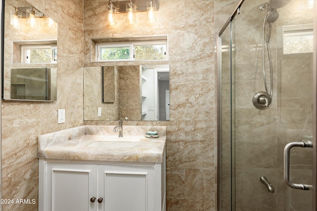 bathroom featuring vanity and walk in shower