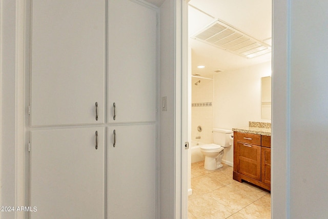 bathroom featuring a shower, tile patterned flooring, toilet, and vanity