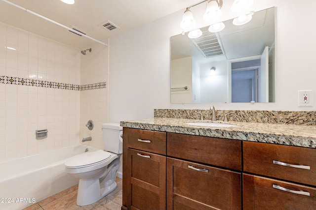 full bathroom featuring vanity, toilet, tile patterned floors, and tiled shower / bath