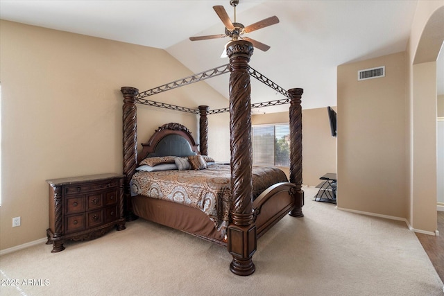 carpeted bedroom featuring lofted ceiling, visible vents, a ceiling fan, and baseboards