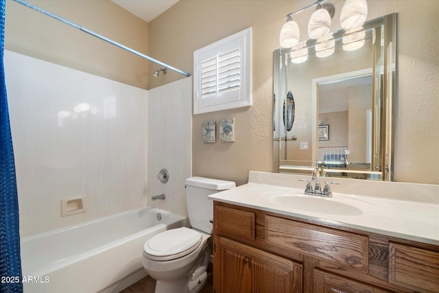 full bath featuring toilet, a textured wall, vanity, and bathing tub / shower combination