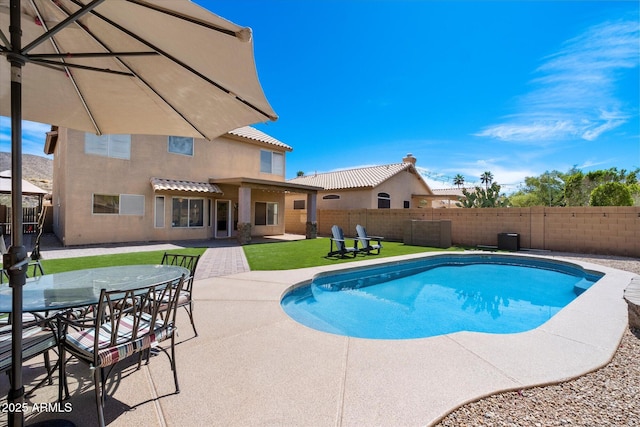 view of swimming pool with a fenced in pool, a patio, and a fenced backyard