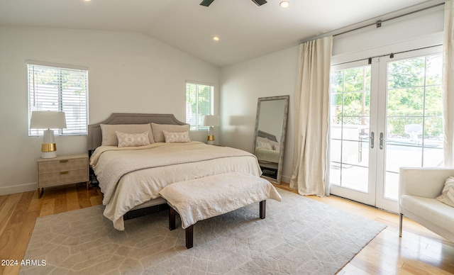 bedroom with light hardwood / wood-style flooring, access to exterior, vaulted ceiling, and french doors