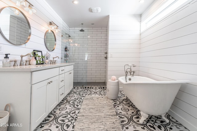 bathroom featuring vanity, independent shower and bath, and tile patterned flooring