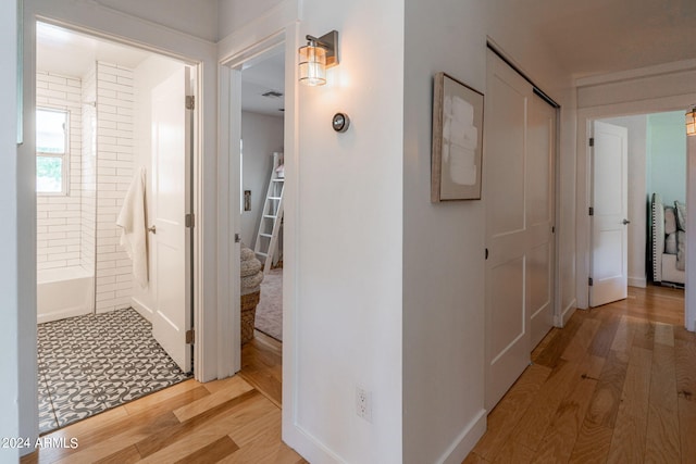 hallway featuring light hardwood / wood-style flooring