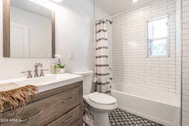 full bathroom featuring shower / tub combo with curtain, vanity, and toilet