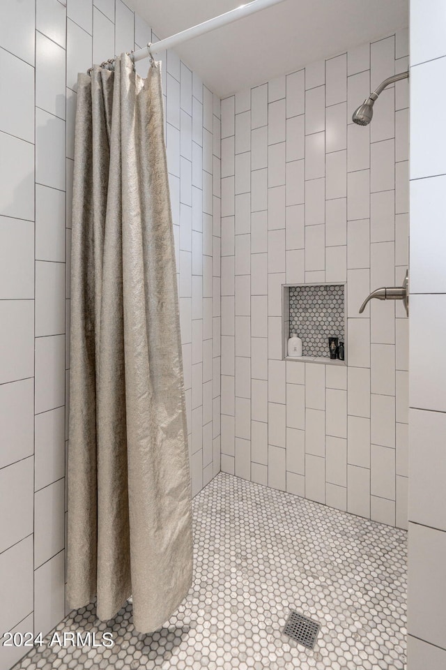 bathroom with a shower with shower curtain