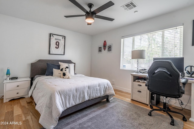 bedroom featuring ceiling fan and light hardwood / wood-style flooring