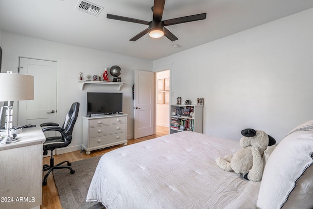 bedroom with ceiling fan and light wood-type flooring