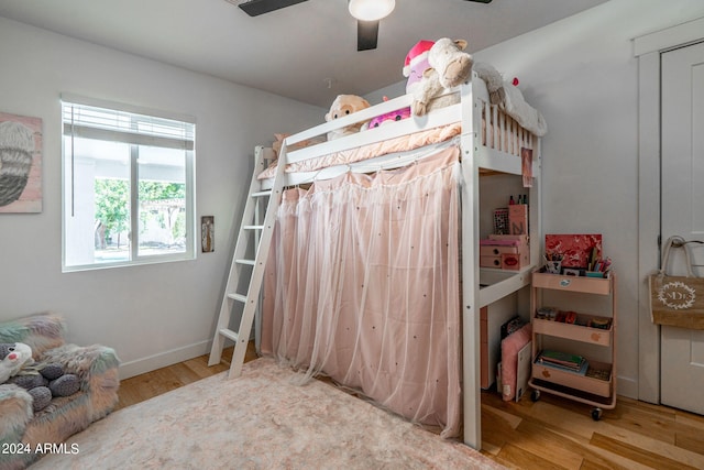 bedroom featuring hardwood / wood-style floors and ceiling fan