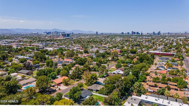 birds eye view of property featuring a mountain view