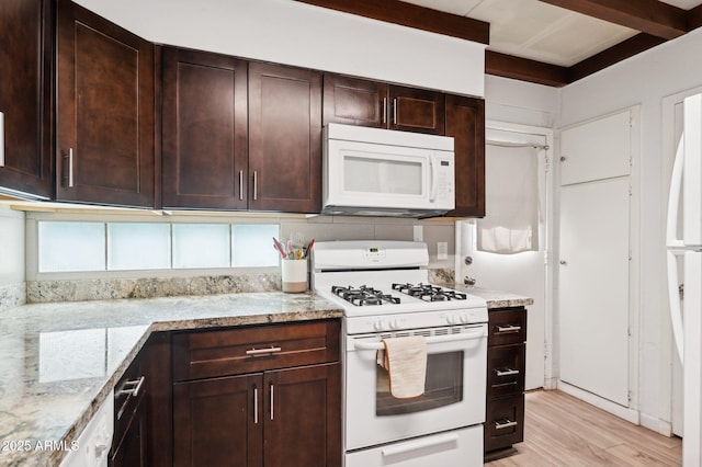 1101 E Bethany Home Rd Unit 1, Phoenix, AZ 85014 - kitchen featuring white appliances, light stone counters, light wood-style floors, and dark brown cabinets