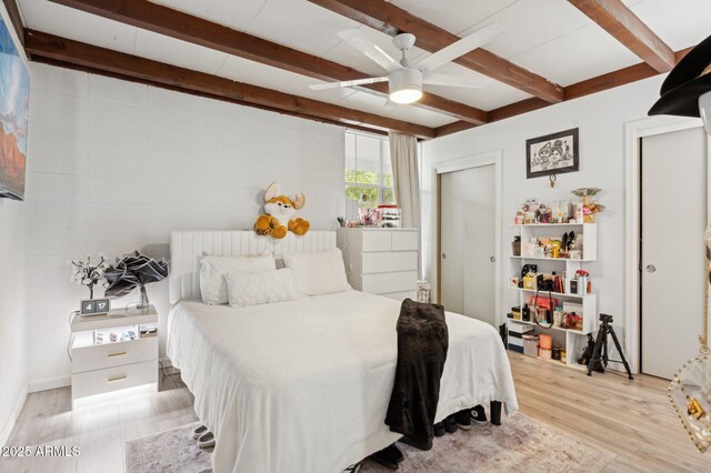 1101 E Bethany Home Rd Unit 1, Phoenix, AZ 85014 - bedroom with light wood-style floors, beamed ceiling, and ceiling fan