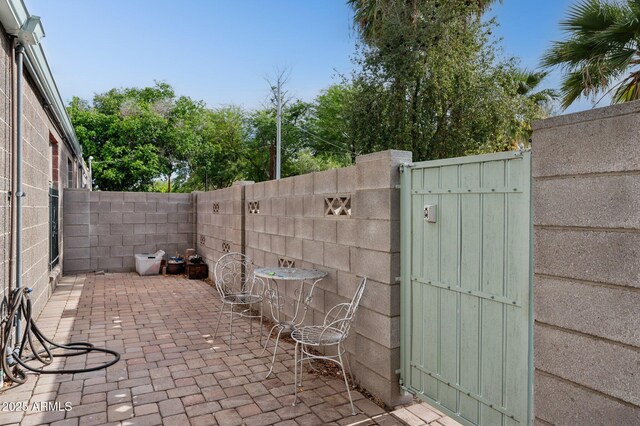 1101 E Bethany Home Rd Unit 1, Phoenix, AZ 85014 - fenced backyard with a patio and a gate