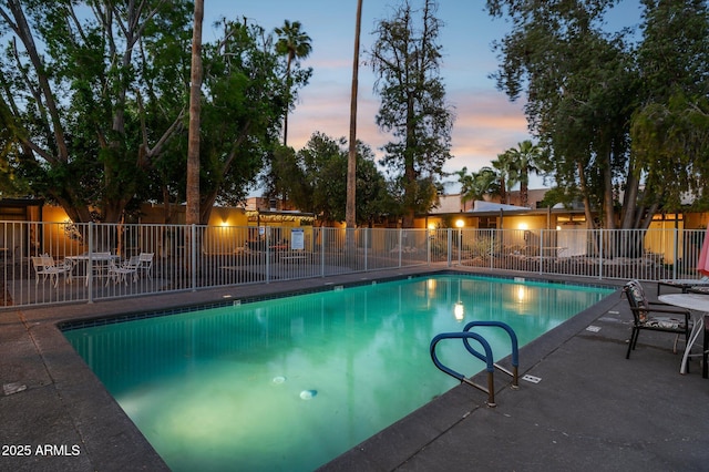 1101 E Bethany Home Rd Unit 1, Phoenix, AZ 85014 - pool at dusk with a community pool and a patio