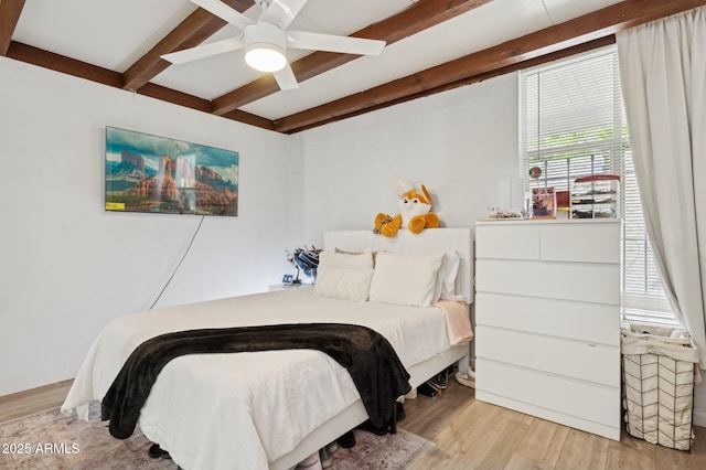 1101 E Bethany Home Rd Unit 1, Phoenix, AZ 85014 - bedroom with beam ceiling, wood finished floors, and a ceiling fan