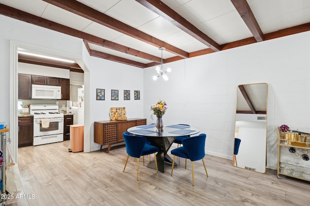 1101 E Bethany Home Rd Unit 1, Phoenix, AZ 85014 - dining area with beam ceiling, light wood-style flooring, a chandelier, and arched walkways