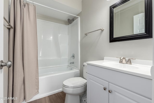 full bath with shower / bath combo with shower curtain, vanity, toilet, and wood finished floors