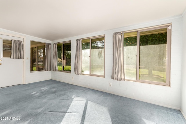 unfurnished sunroom featuring vaulted ceiling