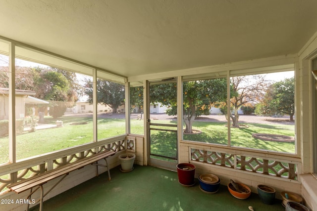 unfurnished sunroom featuring plenty of natural light