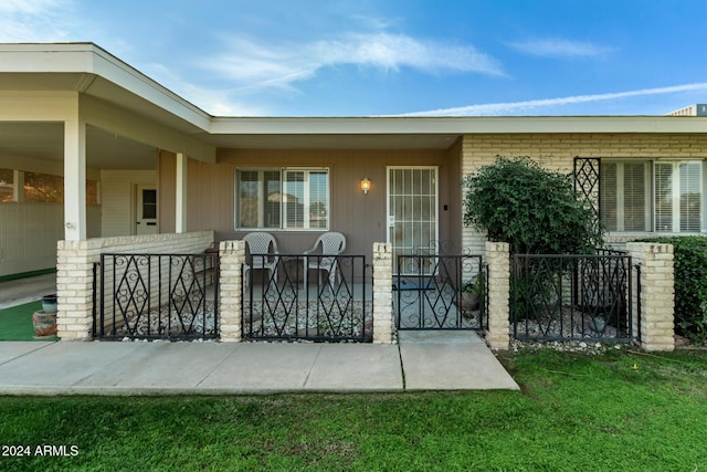 doorway to property with a porch