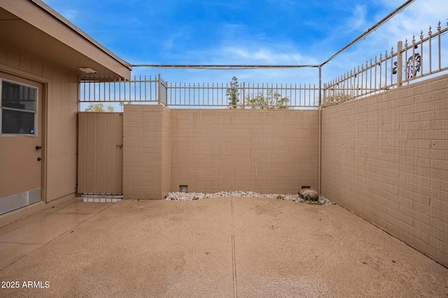 view of patio / terrace featuring fence