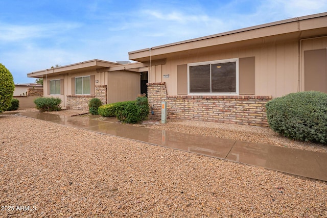 view of front of home featuring brick siding