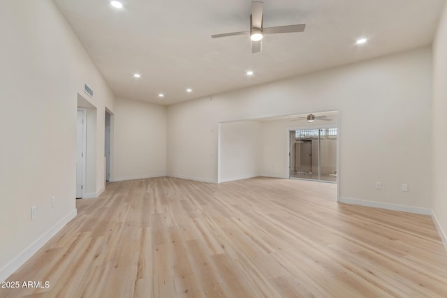 empty room with light wood-type flooring, visible vents, baseboards, and recessed lighting