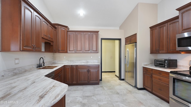 833 N 110th St, Mesa, AZ 85207 - kitchen with appliances with stainless steel finishes, a sink, and light stone counters