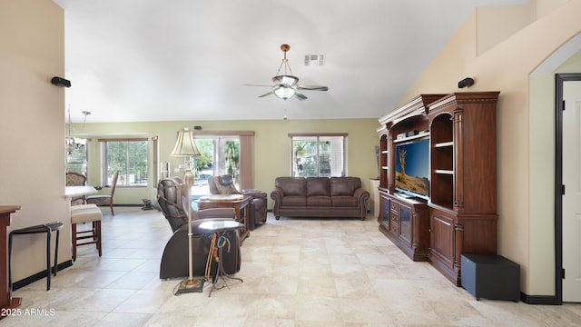 833 N 110th St, Mesa, AZ 85207 - living area with a ceiling fan, healthy amount of natural light, lofted ceiling, and light tile patterned floors