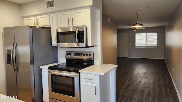 kitchen featuring white cabinets, appliances with stainless steel finishes, dark hardwood / wood-style flooring, and ceiling fan